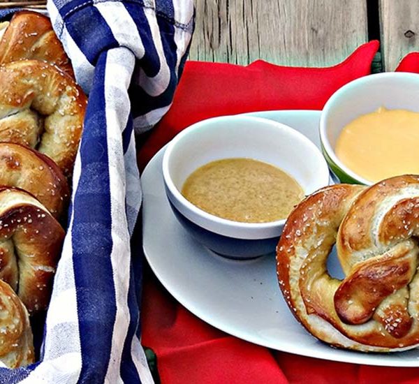 Hot pretzels with cheese and mustard dipping sauces