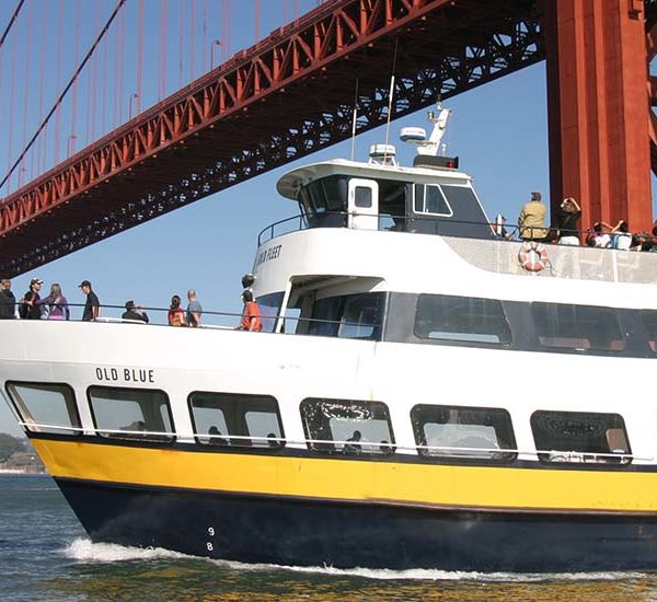 Blue & Gold Fleet boat going under the Golden Gate Bridge