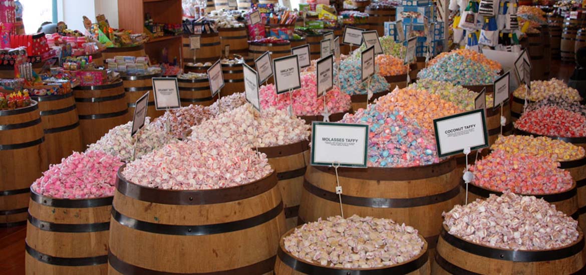 Barrels of colorful salt water taffy at Candy Baron