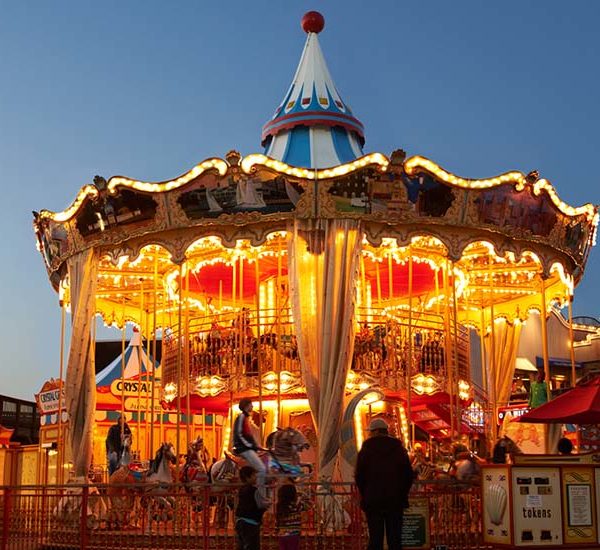 Carousel at night with thousands of twinkling lights