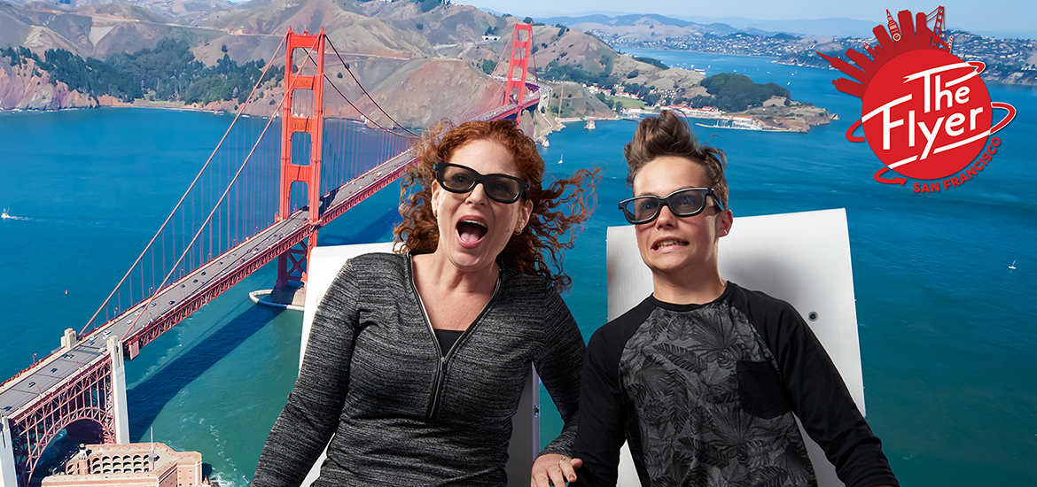 Mother and boy on The Flyer ride with Golden Gate Bridge in background