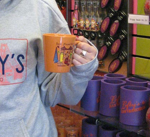 Left-handed coffee much and close up of sweatshirt at Lefty's